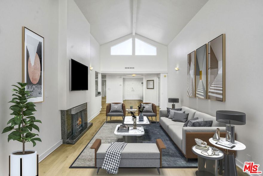 Rare front-facing top-floor penthouse in prime Westwood. This single-level, spacious 2-bed, 2-bath residence spans 1,991 square feet and features soaring vaulted ceilings, abundant natural light, and treetop views from multiple vantage points. The large living room with fireplace opens to a private terrace, ideal for quiet mornings or evening entertaining. An updated kitchen offers generous cabinetry and a breakfast area, adjoining a formal dining space with built-in bar. The expansive primary suite includes dual closets, a walk-in, and a beautifully scaled bath with separate soaking tub and shower. A second bedroom and full guest bath complete the well-proportioned layout. Additional features include in-unit laundry, central HVAC, and gated side-by-side parking with EV charger. The building offers controlled access, pool, spa, fitness room, and a community recreation space with pool and ping pong tables. Ideally located moments from UCLA, Westwood Village, and Brentwood. 13 month minimum lease.