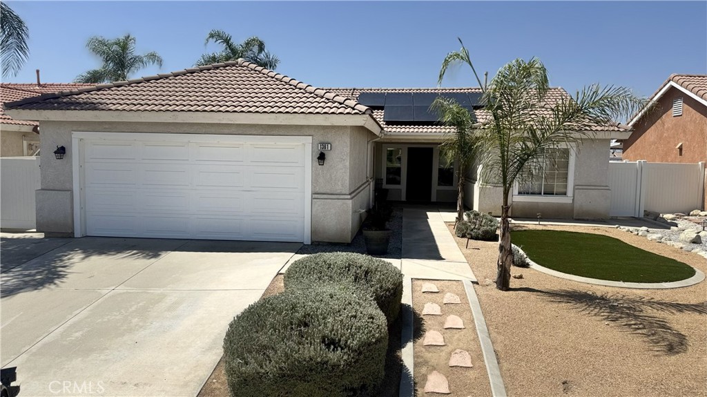 Ready to go. This 3 bedroom 2 bath home can be yours. Property has new carpet in Living room and Primary bedroom. This home has Tile roof, covered Aluma wood patio, Vinyl fencing. Primary Bedroom and bath on one side and 2 other bedroom and baths on opposite side of home Low -low maintenance with Artificial turf front and back with some drought resistant landscaping. Spacious Kitchen with gas oven and dishwasher. Indoor laundry room. 2 car garage with finished drywall. Close to shopping, minutes to downtown Redlands. Redlands School district and much more. Great location in middle of housing tract. -Buyer to assume solar lease of $119 per month currently