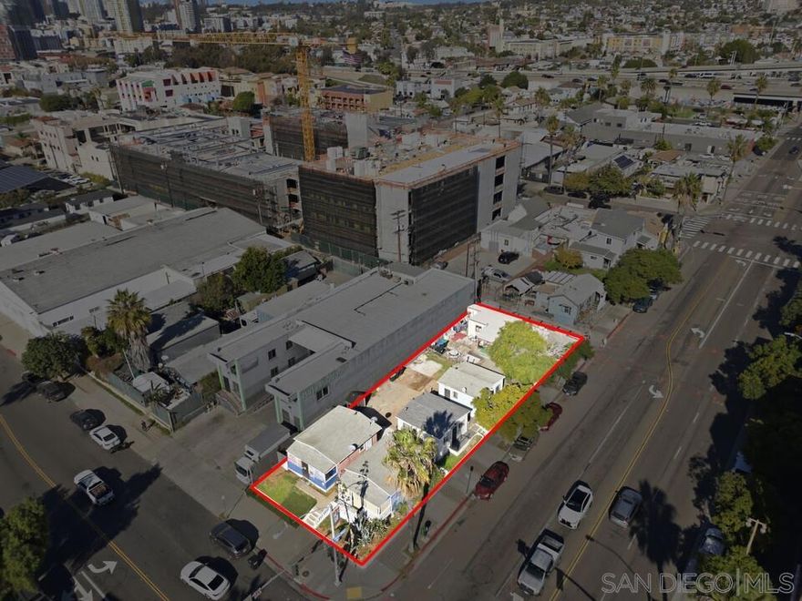 Once in a lifetime development opportunity in a highly desired opportunity zone in a fast growing neighborhood! You can potentially build 35+ residential units plus ground floor commercial retail space with CN 1-4 zoning allowing up to a 65ft height limit, this is a rare opportunity! On a corner lot, this property faces 2 streets and has alley access, which is key for a complete community development. Being so close to public transportation, this property may qualify for a complete community and Bonus ADU programs. This property could get even more exciting as SB-79 passes and hopefully being able to add even more units! Located in an opportunity zone, this property could provide substantial tax savings if bought through a QOF. Featuring 5 detached houses all roughly 350sqft each which gross about $10k a month, providing strong cash flow that can help with carrying costs as a potential developer goes through plans and permitting phases. Nearly $100k worth of upgrades has been invested into the property this year with new sewer line, new water lines, new electrical service, and a full remodel on one of the units. This could be a great buy and hold or development opportunity in one of San Diego's trendiest markets with views to Downtown San Diego and Petco Park and minutes to Coronado, Chicano Park, and the Navy Base.