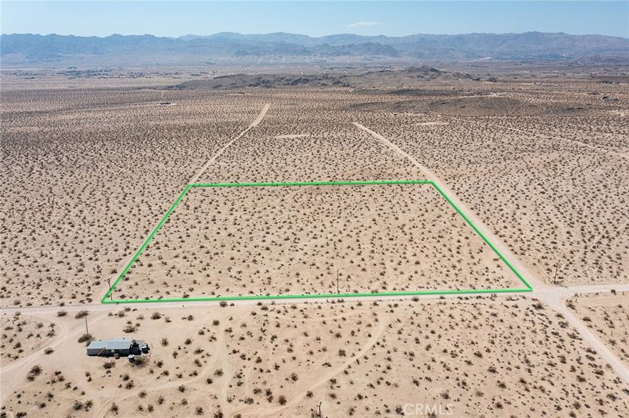 10-ACRE PARCEL: Southern California Edison electric poles (SCE) along northern side of parcel. Water nearby. Easy access on La Brisa Dr to paved Sunfair Rd to the east and paved Border Ave to the west. Plans for architecturally significant homes nearby. Up-and-coming area of Joshua tree. Rural living with convenient access to downtown Joshua Tree and the hospital for medical. Official street address assigned by the County – the first step to getting permits to build. NOTE: Green lines demarcating boundaries in pictures are approximate. APN: 0606-321-11