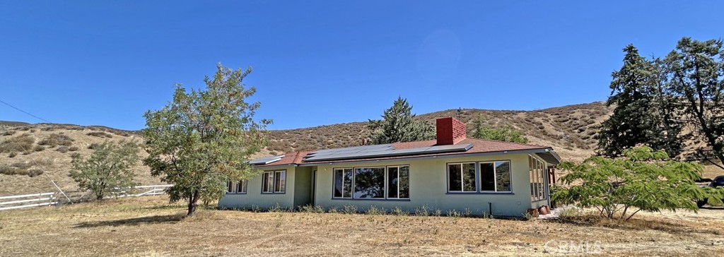 High tech Ranch Home on 5 acres in beautiful Leona Valley. Ideal property for working from home! Enjoy the rural lifestyle and country living with all the modern conveniences. Home is energy efficient and turn key ready. Tesla solar panels, EV charging station and Starlink internet. Smart home amenities include sound system, USB ports, smart thermostat, security system and fingerprint door entry. This 3 bedroom, 1 1/2 bath ranch house has updated bathrooms and kitchen, new windows, new flooring and new paint! Two car detached garage and storage shed. Move in ready!