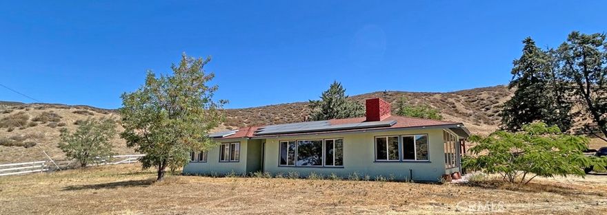 High tech Ranch Home on 5 acres in beautiful Leona Valley. Ideal property for working from home! Enjoy the rural lifestyle and country living with all the modern conveniences. Home is energy efficient and turn key ready. Tesla solar panels, EV charging station and Starlink internet. Smart home amenities include sound system, USB ports, smart thermostat, security system and fingerprint door entry. This 3 bedroom, 1 1/2 bath ranch house has updated bathrooms and kitchen, new windows, new flooring and new paint! Two car detached garage and storage shed. Move in ready!