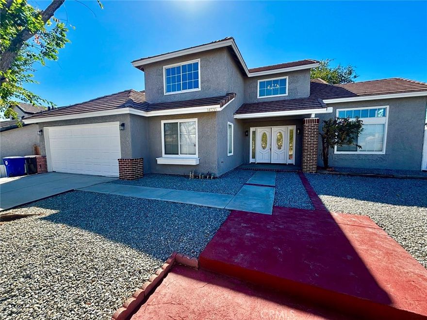 This is A must-see house with a spacious layout. Upon entering, you will be welcomed by high ceilings that give the home an open and airy feel. The layout includes a formal dining area, a large living room, and an open kitchen with a cozy fireplace. The downstairs features a versatile den that can be used as a home office, as well as a bedroom with an adjacent bathroom. This makes it perfect for guests or in-law visits. The primary suite is upstairs and includes dual sinks, a soaking tub, and a walk-in closet. While public records show a total of three bedrooms, this property has been modified. The owner has added three additional bedrooms, making it ideal for a large family. An attached 2-car garage provides plenty of storage and convenient access. The home is in an established Victorville neighborhood with easy access to amenities and major roads