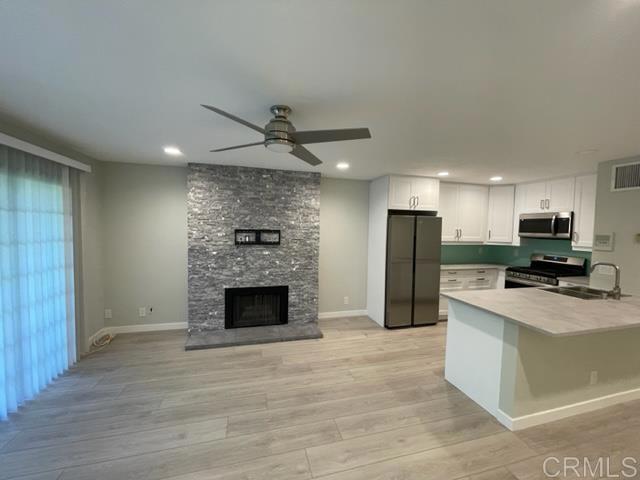 Showings starting on Sunday 8-10-25 at the Open House 1-4. Step into the elegance and comfort of this meticulously remodeled 1-bedroom/1-bath condo, nestled within the picturesque St. Albans private community. Situated in the coveted South Coast Metro area, this charming residence offers a serene retreat with convenient access to nearby attractions. Immerse yourself in the vibrant atmosphere as you stroll to South Coast Plaza and an array of delightful restaurants. View one of the two pools from your spacious balcony, perfect for unwinding. For additional recreation there is a gym and two tennis courts. The kitchen boasts all newer appliances, providing a stylish and functional space for culinary enthusiasts. Stay comfortable year-round with central heating and air conditioning. There is a stackable washer/dryer for your convenience. Cozy up to the warmth of a delightful fireplace. Contact us today to schedule your private viewing.