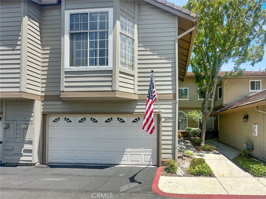 Welcome home to this spacious, open floor plan condominium, in the sought-after city of Laguna Hills! As you enter you will notice effortless sophistication with this stunning condominium, with new flooring, and aesthetically selected paint color scheme. The spacious layout seamlessly connects the living, dining, and kitchen area. The spacious family room is setup with a crafted fireplace, creating a wonderful ambiance for relaxation, while also providing convenient access to a half bath. The gourmet kitchen is a chef’s delight, appointed with contemporary cabinetry, gleaming countertops, and stainless-steel appliances. Whether you are hosting friends or savoring a quiet morning, the generous island provides the ideal space for gathering. The condo boasts three spacious bedrooms and multiple upgraded bathrooms. Retreat to the tranquil primary bedroom, complete with plush carpeting, a walk-in closet, a double sink vanity with ample counter space, and a glass-enclosed shower. The other bedrooms offer natural lighting through multiple windows and roomy open area with amble closet space. The upstairs hall bathroom room offers a double sink vanity with a bathtub and shower. This charming condo features a spacious outdoor patio surrounded by fruit tress, prefect for enjoying your morning coffee or hosting a BBQ. There is also plenty of room for a table and grill. The seamless indoor-outdoor flow makes this the ideal space for relaxing or entertaining year-around. Pride of ownership shines throughout this beautifully maintained condo, don’t miss your opportunity to make this amazing property yours.