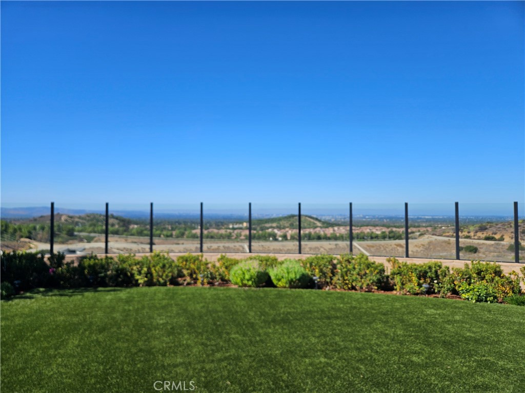 Imagine coming home to breathtaking panoramic views. This modern, three-bedroom, two-and-a-half-bathroom house is in **The Reserve**, an exclusive, gated community in Orchard Hills, Irvine.
This home sits on a quiet, elevated cul-de-sac with only one neighbor, giving you extra privacy. Inside, you'll find a blend of elegant design and premium, energy-efficient features. The main living area has an open feel with high ceilings and stylish tile floors, while the bedrooms have soft carpet.
The kitchen is a standout, featuring top-of-the-line appliances, sleek cabinets, and a large island that's perfect for cooking and entertaining. The living and dining rooms are bright and inviting, with multi-panel sliding glass doors that open to your private, low-maintenance backyard.
Upstairs, the main bedroom suite includes a spa-like bathroom and a large closet. The two additional bedrooms are flexible enough for a family, guests, or a home office.
Living in The Reserve means you get to enjoy incredible resort-style amenities, including sparkling pools, scenic trails, and beautiful parks. The community is also part of a highly-rated school district (Northwood High School/Sierra Vista / Canyonview).