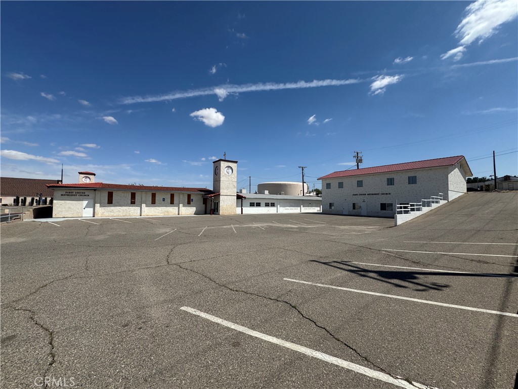PRIME SIGNALIZED CORNER LOCATION!! 1.86 about 2 acres of prime commercial property!! Located In The Heart Of the City: right across from Barstow DMV, and right next to CHP Office, City of Barstow, Superior Court of San Bernardino, and Barstow High School. Subject property is the First United Methodist Mission Church Of Barstow. Site Has A Flexible Building Layout And A Great Opportunity For A Religious Organization, School, Medical Office, Non Profit, convert to an apartment complex or explore your own vision and development plan!! Approximately 16,614 Square Feet Of Building Space. Sanctuary Seats Over 250 plus, Multi Purpose Rooms, 2 Story Building With Classrooms, 2 Social/Fellowship Halls, Kitchen, Administration Offices, Conference Room & more. There Is A Building At The Top Of The Driveway, That Is Currently Being Rented By The City, And Being Used As a Thrift Store. HUGE Asphalt Parking Lot front and back, can park 100s of cars. MOTVATED SELLERS!!
