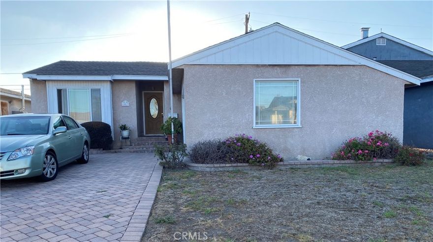 This charming single-family home offers 5 bedrooms and 2 1/2 bathrooms across 1,821 square feet, nestled on a beautiful 5,255 square foot LOT. Enjoy the bright, open floor PLAN.  The heart of this home is its bright kitchen/living area with a built in wood burning fireplace and separate living room off the entry way that could be used for a large home office.