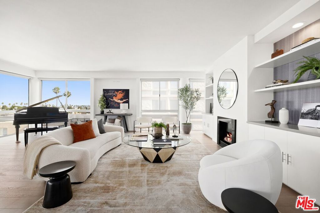 Located in a quiet and desirable Beverly Hills neighborhood, this renovated 2-bedroom, 2.5 bath, with an open floor plan and wood flooring throughout. The living room is a massive open space with lots of windows affording an abundance of natural light, opening out to a private balcony for a great VIEW of the city and mountains. The primary bedroom with a full en suite bath and generous closet space. The second bedroom is also well-sized with its own bathroom, and a third bathroom off the hallway for guests. A separate in-unit laundry area near the kitchen adds everyday convenience. Two side-by-side parking spaces with extra storage cabinets. Wonderful pool and lounging area for outdoor enjoyment. Secure building in a wonderful location.