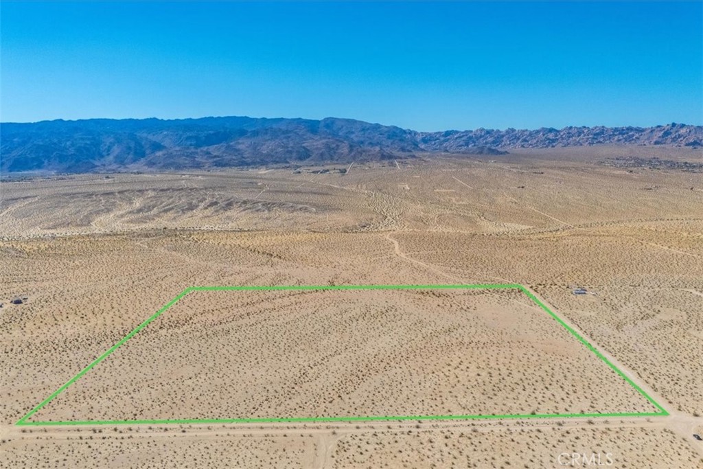 PRICE IMPROVEMENT! Discover your own desert haven on this expansive 38.79-acre parcel in the Desert Heights area of Twentynine Palms. With absolutely panoramic mountain views, this property offers a serene backdrop for those seeking a private retreat or development opportunity. The paid water meter is already in place, adding to the convenience, though the buyer should verify the availability of power. Located just a short drive from Joshua Tree National Park, local hiking trails, and the artistic community of Twentynine Palms, this property is perfect for anyone looking to embrace the wide-open beauty of the high desert.