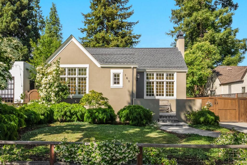 Nestled on a coveted tree-lined street in Redwood City's Mt. Carmel neighborhood, this thoughtfully remodeled home perfectly blends timeless design and modern comfort. Vaulted ceilings flood the spacious living room with natural light and a cozy fireplace anchors the home's welcoming atmosphere. The chef's kitchen boasts an induction range and custom cabinetry and opens seamlessly to the living and dining areas, creating a dramatic great room ideal for everyday living and entertaining. The main residence offers 4 beds and 2.5 baths, including a primary suite with a recently updated spa-like bathroom. The family room extends to a lush, low-maintenance backyard with multiple seating areas, designed for year-round gatherings. A recently renovated 1-bed, 1-bath detached ADU adds exceptional flexibility for multi-generational living, guests, or potential rental income. Adding to the charm, this idyllic block is home to a close-knit community of neighbors who celebrate year-round holidays, block parties, and more. Located just a half block from Stafford Park - home to Music in the Park - and just over a mile from Downtown Redwood City's vibrant shops, dining, and events like "Movies on the Square", this property offers an unbeatable combination of lifestyle, location, and versatility.