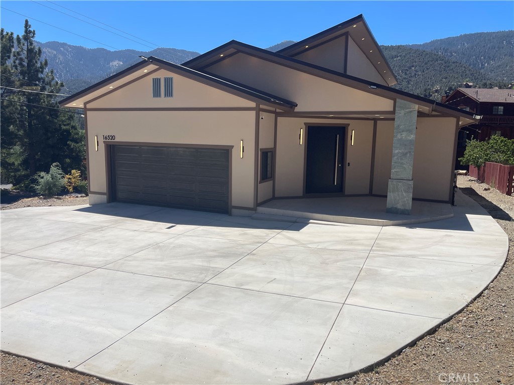 Are you looking for a one-of a-kind custom home? We just listed this 3 bedroom 2 full bath home w/ special office w/ view of the north side of Mt Pinos. Located on the sunny side of PMC. Everywhere you look is something custom, 30'dx22'w Garage, Electric panel home center wifi ready, 12 solar panels , 4 Mitsubishi heat/ac systems,24,000 btu in greatroom, 9,000 btu units for the bedrooms, smart 50 gal electrical water heater, Jack & Jill guest bedrooms w/ smart bathroom w/ bidet and walk-in shower. Master suite also has the view of the north side of Mt Pinos, walk-in closet w/ smart bathroom also. You enter thru an oversized 54" metal custom door on a swivel, to 4'x4' custom tile flooring throughout the home. Greatroom has an oversized kitchen w/ 36" Electric cooking stove, Custom island w/ stone counter, New Stainless Steel appliances included, Also a 64" wide Electric Fireplace for those cool evenings. Water system is installed for all of the trees and plants w/ a smart system linked to the weather channel. You must come see this special home.