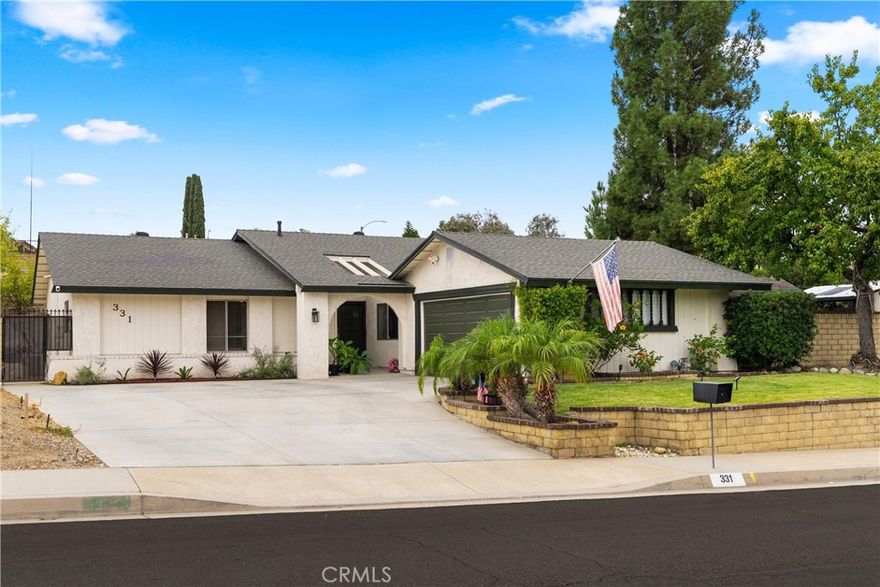 Discover this beautifully updated 3-bedroom, 2-bathroom, 1,553 sq. ft. single-story home, perfectly situated on an expansive 10,685 sq. ft. corner lot with RV parking. Designed for effortless living, this home features no steps inside - ideal for accessibility, comfort, and multigenerational living. Through the double front doors is a warm and inviting living room, anchored by a cozy fireplace perfect for cozy evenings or hosting guests. To the right, the bright family room flows seamlessly into the fully remodeled kitchen, boasting sleek quartz countertops, modern shaker cabinets, and stainless steel appliances. There are two convenient sliders opening to the backyard, blending indoor and outdoor living, in both the kitchen and living room. Down the hall, two generously sized bedrooms share a well appointed full bathroom. The private primary suite is a true retreat, featuring a spacious walk-in closet and a modern ensuite bathroom all with a touch of serenity. Outside, the massive backyard offers endless possibilities, complete with RV parking, a storage shed, and a unique aviary (birds not included). With luxury vinyl plank (LVP) flooring throughout, fresh updates, and a thoughtful single-level design, this home is move-in ready and waiting for you to make it your own.