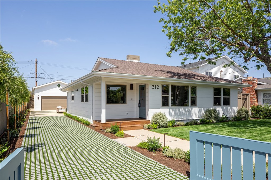 Expertly crafted by local firm Abode Design + Build, known for their thoughtful integration of architecture and interiors, this rare dual-residence property blends timeless coastal style with modern functionality in one of Eastside Costa Mesa’s most coveted neighborhoods. Set on a generously sized 8,000+ sq ft lot, the home offers two completely independent living spaces—ideal for multi-generational living, guest accommodations, or premium rental income. Set behind a gated entry with lush, magazine-worthy landscaping by Orchard Landscaping, the grounds feature extensive new hardscape, a turf block driveway for enhanced curb appeal and drainage, and multiple outdoor areas for entertaining and relaxation. The front residence, a reimagined single-level 3-bedroom, 2-bath home, spans 1,640 sq ft and has been fully remodeled and expanded to create open-concept living with high ceilings and abundant natural light. Large skylights brighten the interior throughout the day, while oversized sliding glass doors create a seamless indoor-outdoor connection. The spacious primary suite includes dual closets and a beautifully appointed bath, offering a true retreat within the home. Built-in speakers provide effortless audio throughout, complementing the all-new appliances, custom cabinetry, and curated finishes. At the rear, a brand-new 2-bedroom, 2-bath ADU (938 sq ft) offers private luxury living with its own entrance, full kitchen, solar panels, and a finished 2-car garage. Like the front unit, it features expansive sliding doors that open to an inviting patio and skylights that fill the interior with light. Built-in speakers and premium materials complete the experience in this high-end, standalone residence. This unique offering delivers flexibility, long-term value, and low-maintenance luxury just minutes from beaches, top schools, restaurants, and retail.