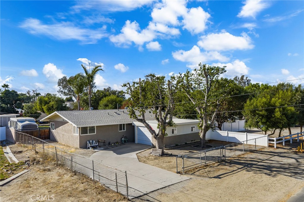 **Norco Horse Property with Modern Comfort & Room to Ride!** Welcome to your next chapter in Horsetown USA! This beautifully upgraded 3-bedroom, 2-bath home sits on a generous lot designed for equestrian living—with all the modern touches you’ve been looking for. Step inside to an open, airy layout that feels fresh and inviting. The kitchen is a showstopper with custom cabinetry, sleek countertops, and a deep upgraded farmhouse sink that’s as practical as it is stylish. The spacious great room is perfect for relaxing after a long ride or hosting family gatherings. The primary suite offers a private ensuite bath, while the additional bedrooms provide ample space for guests, tack storage, or a home office. Outside, enjoy a large covered patio ideal for morning coffee or evening sunsets. The flat, usable land is ready for your horses, goats, or other four-legged companions complete with a barn, storage shed, and pens—with plenty of room to add more corrals, shelters, or a round pen. RV owners will love the abundant parking for rigs and trailers, plus extra space for guests and overflow. A brand-new HVAC system keeps things cool year-round, and every inch of the home has been thoughtfully updated for comfort and style. The roof was also replaced just 5 years ago! Located in the heart of Norco with riding trails, feed stores, and community events that celebrate the equestrian lifestyle. This property is priced to move—don’t miss your chance to own a turnkey home with all the space and freedom you’ve been dreaming of. Saddle up and schedule your showing today—this one won’t last!