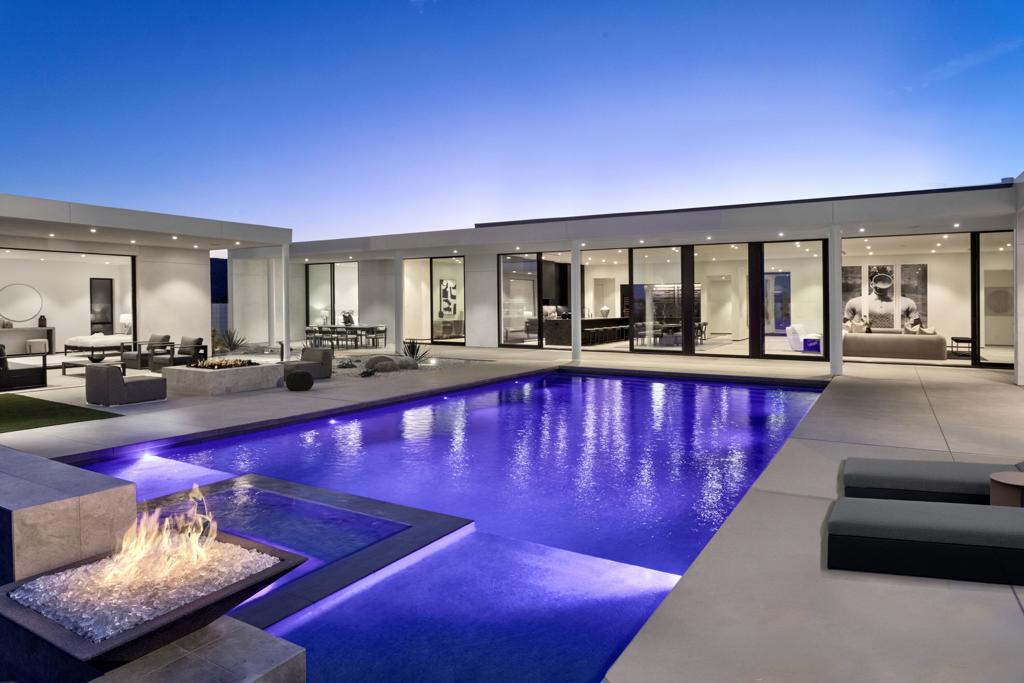 Residence Fourteen in Linea Rancho Mirage presents the essential qualities of desert resort architecture--providing a long central pavilion with a series of flexible living spaces throughout. Our interior design team created a warm environmental pallet of natural woods and bespoke black stone surfaces, producing a 'Zen like' ambiance with modernist intentions of space and light. The glass hallway to the master suite is emblematic of the classic indoor/outdoor connections throughout the residence to the surrounding desertscapes. A complete guest house reflects the same design elements as the main residence and can be utilized for independent living, a luxurious suite for visitors or accommodations for full-time staff.This 4,737 square foot 5 bedroom home is replete with luxury features and finishes: Wolf & SubZero appliances including a wine tower, Aranelli Italian cabinetry, seemingly endless facades of floor-to-ceiling Fleetwood glass, spa inspired main bath with steam shower, solar arrays and batteries, pebble finish salt water pool and more.A modern peaceful desert oasis like no other.