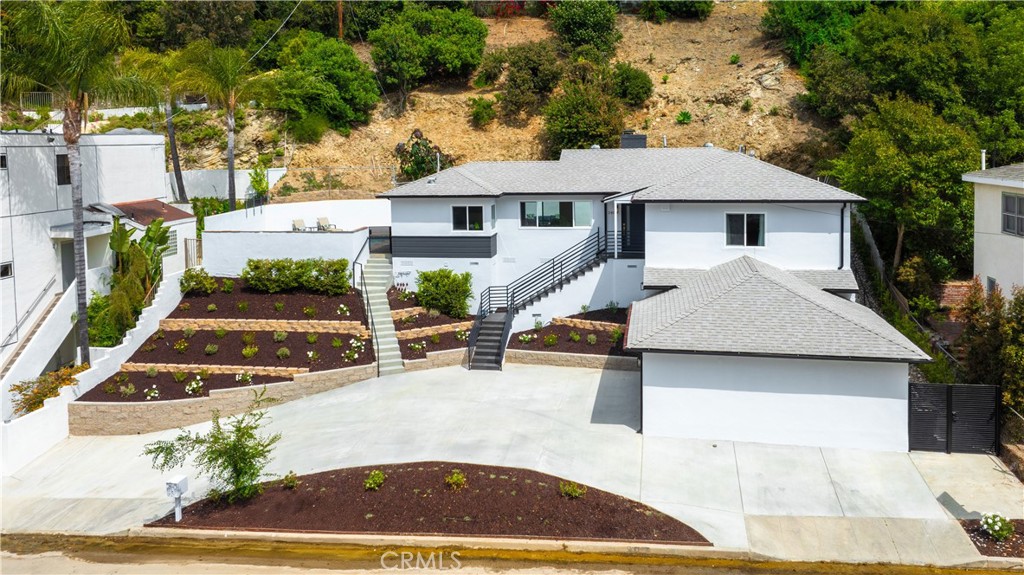 Welcome to your dream home, South of the Boulevard in Sherman Oaks! This beautifully just completed modern residence offers three spacious bedrooms and four luxurious baths, all enhanced by high-end finishes. Step inside to discover an open floor plan adorned with elegant laminate flooring, seamlessly connecting the living, dining, and kitchen areas.
The en suite primary bedroom provides a serene retreat with its sophisticated design and ample closet space. Enjoy the convenience of an attached direct entry garage and an oversized circular driveway, making parking a breeze.
Relax and entertain in your private oasis featuring a sparkling pool and a cozy fireplace in the living room and outside on the patio. Laundry on the main floor adds to the home's practical charm.
Nestled in a walkable neighborhood, you're just moments away from premier shopping and dining options. Plus, with easy access to the 101 freeway, your commute will be a breeze. This stunning home is a perfect blend of modern luxury and everyday convenience. Don't miss out on this exceptional opportunity!