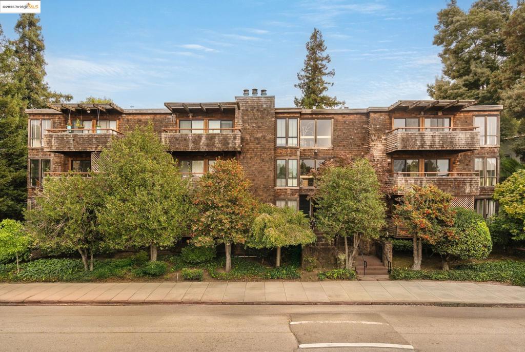 Welcome to 742 Wesley Way - Oakland living at its finest!  This sought-after boutique condo was built in 1981 with just 15 units. It's centrally located - a short stroll to landmarks like Lake Merritt and the Grand Lake Theater, plus amenities and retail galore along main avenues Lakeshore and Grand.   #2C is a spacious 912 square foot 1-bedroom, 1-bathroom with treehouse vibes. A retreat from city life, the floor-to-ceiling windows and large balcony invite the outside in; the perfect setting to enjoy and relax in privacy.   The unit's warm, contemporary design features a fireplace and accent walls, tile and light fixtures. Tasteful, quality finishes make the kitchen and bathroom stand out aesthetically, while in-unit laundry, below-ground parking and additional storage highlight convenience.   *97 walk score, local and transbay buses nearby, Trader Joe's across the street, as well as the weekly farmer's market!