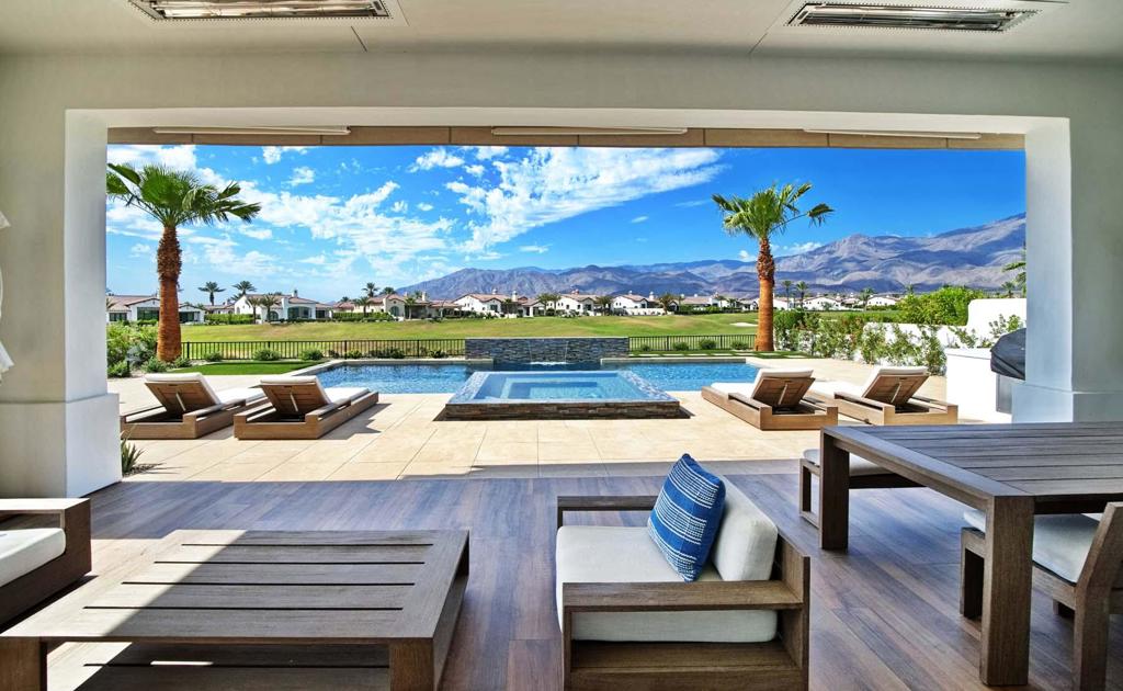Welcome to effortless elegance and modern desert charm in this beautifully furnished 2023 Spanish Transitional Plan 301, ideally situated on the 11th fairway of the renowned Rees Jones course at Andalusia Country Club. Offering 3,333 sq. ft. of refined living space and stunning south-facing views of the Santa Rosa Mountains, this home delivers a perfect blend of style, comfort, and sophistication.Inside, clean architectural lines and high-end finishes define the open-concept layout. The great room features disappearing sliding glass doors that create a seamless transition to the covered patio and private interior courtyard--perfect for relaxed indoor-outdoor living. The gourmet kitchen is both sleek and functional, appointed with premium appliances and custom cabinetry, designed to suit both everyday living and entertaining.The primary suite offers a tranquil retreat with a spa-like bathroom including a freestanding soaking tub, walk-in shower, and generous storage. A separate guest casita with its own entrance provides flexible space for visitors, a home office, or creative studio.The backyard is an inviting escape, complete with a custom pool and spa framed by sweeping golf course and mountain views. Whether entertaining or unwinding, this home captures the essence of luxurious desert living.Turnkey furnished per inventory, this is a rare opportunity to own a thoughtfully designed, move-in-ready home in one of the Coachella Valley's most sought-after private communities.