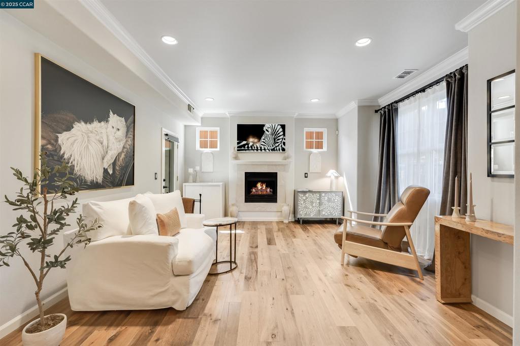 Open Saturday and Sunday 1pm-4pm! Welcome to 230 El Pinto, a stylish single level condominium privately nestled in Danville on the Alamo border. Built in 2005 this upgraded 2-bedroom 1-bathroom ground floor condo located in an intimate nine-home community is thoughtfully designed boasting a one car garage for secure parking and additional storage. Within this airy home you will enjoy 9ft ceilings, crown molding, chandeliers, hardwood floors, porcelain kitchen tile, granite countertops, marble subway tile backsplash and custom Big Chill appliances. The marble floored bathroom with marble vanity has an in unit laundry closet. Everyone can appreciate the fully fenced secure backyard with front and back gates perfect for pets and gardening. This young property has low HOA dues. Mere moments from downtown Danville enjoy an abundance of local shops, dining, the Iron Horse Trail and amazing grocery stores. Ideal commuter access to I-680, connecting you quickly to Walnut Creek and San Francisco. Not to mention being zoned for highly rated award-winning San Ramon Valley schools! The bottom line is that this move-in-ready gem will be perfect for anyone seeking a refined, low-maintenance home with rare outdoor space and premium upgrades in an unbeatable location!