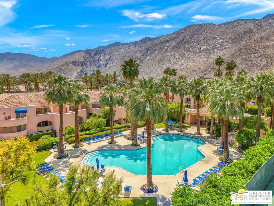 Looking for the perfect desert escape and an investment opportunity? Welcome to Palm Springs Deauville, just blocks from the buzz of Palm Canyon Drive. Designed by celebrated desert architect Hugh Kaptur, this upper-level condo features vaulted ceilings, clerestory windows, an open-concept layout, and abundant natural light. Both the main living area and the ensuite bedroom open to a private patio with pleasant views and a quiet location away from road noise. This one-bedroom, two-bath home is ideal for part-time residents or vacation rental investors, with gated security, a dedicated storage closet, and an additional large underground storage unit. Resort-style amenities include three sparkling pools and spas, tennis courts, a fitness center, clubhouse, and underground parking for up to three cars with extra storage and bike space, plus the convenience of an in-unit washer and dryer. Palm Springs Deauville allows 14-day minimum rentals, and the future high-end Dream Hotel and Condos across the street promises even greater long-term value. Whether you're looking to invest, escape, or both, this Palm Springs home is a delight on all fronts.