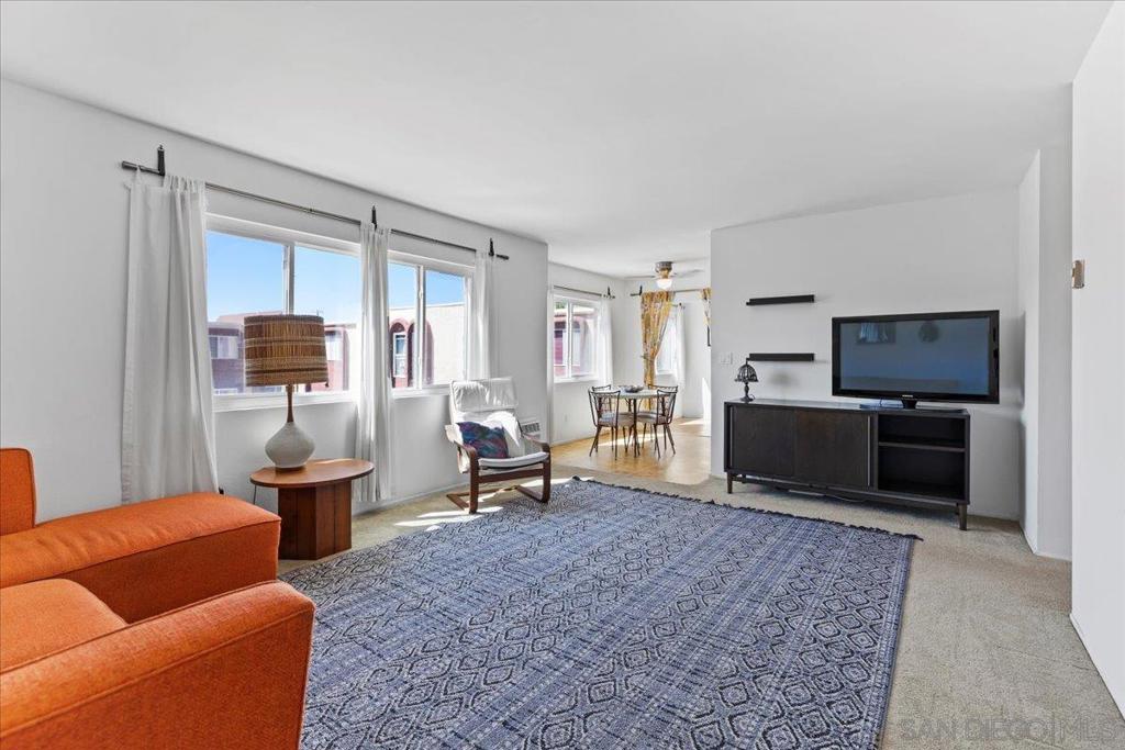 Perfectly situated, this easy living second-floor home is in the heart of Rolando and College East. You’ll be greeted by a light and bright spacious living room that flows to the efficient kitchen and charming dining area. Just beyond, this one-of-a-kind unit includes a bonus room that is located over the breezeway and ideal for an office, exercise room, or extra storage space. With 2 generous bedrooms, the primary suite includes a walk-in closet and private bathroom. The second large bedroom also features a walk-in closet and is adjacent to a second full bathroom, perfect for roommates or guests. Pine Woodlands residents can enjoy relaxing by the sparkling pool or entertaining friends and family at the outdoor BBQ area under the umbrella shaded tables. Other highlights include a gated entrance and an assigned parking space in the secured parking area. With the close proximity to campus and shopping yet the peaceful and quiet setting of the residential neighborhood, students can walk or bike to school, Ralph’s, and a local taco shop. Students, professionals, or families can enjoy the walkability to local coffee shops, local restaurants, schools, and parks all while being a short distance to Trader Joe’s, freeways, and shopping.