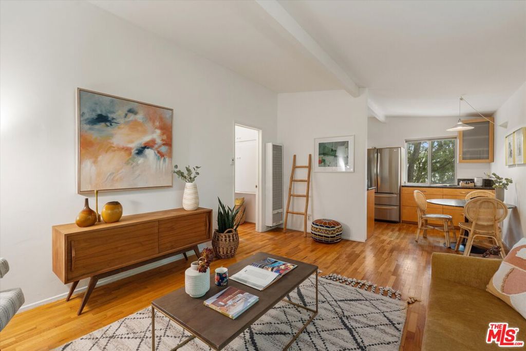Top-Floor Sunset Park Beach Pad Just 10 Blocks to the OceanWelcome to this charming top-floor 2-bedroom, 1-bathroom condo located in a peaceful 6-unit building on a rare dead-end street in prime Sunset Park Santa Monica. With no through traffic and lush tree-lined views, this home offers a truly tranquil setting just 10 blocks from the beach. This front-facing penthouse unit features soaring ceilings, windows on three sides, beautiful hardwood floors, and abundant natural light and ocean breezes throughout. The renovated kitchen blends functionality with style, making this the perfect blend of comfort and convenience. Highlights include:Top-floor unit with only one shared wall. Peaceful and private with no neighbors above. Hardwood floors and tall ceilings throughout. One covered parking space. Well-run HOA with low monthly dues. Charming common area with outdoor seating. Guest parking on a quiet, tree-lined street. Prime location near Main Street, Ocean Park Blvd, and the beach. Excellent opportunity as a starter condo or investment rental. Whether you're looking for a full-time residence, a weekend getaway, or a smart addition to your portfolio, this Sunset Park gem offers Santa Monica beach living with all the charm and ease of a small, well-kept community. Shown by appointment only. Come experience the light, breeze, and character for yourself.