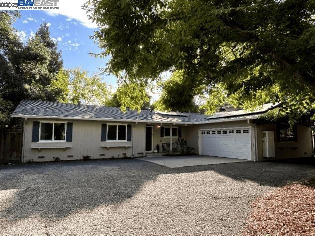 Experience the tranquility of a private estate in Walnut Creek. This 3-bed, 2-bath ranch-style home, nestled on a large, secluded lot, offers 360° privacy. Set back from the street, it's a peaceful retreat. Inside, an open floor plan flows seamlessly, featuring a dedicated office & indoor laundry. Enjoy a sparkling pool & a park-like backyard, beautifully landscaped & ready for enjoyment. 2-car garage & ample parking, with plenty of space for RV parking. Upgrades include: New roof, windows, master bedroom sliding door, interior paint, pool booster pump, pool fence, deer/dog-proof garden fence, dishwasher, washing machine, solar, and EV charging. Conveniently located to excellent schools, transportation routes, and all amenities, this home is perfect for both everyday living and entertaining alike. Desirable Bancroft Elementary School. Located in a quiet, desirable neighborhood in affordable Walnut Creek.