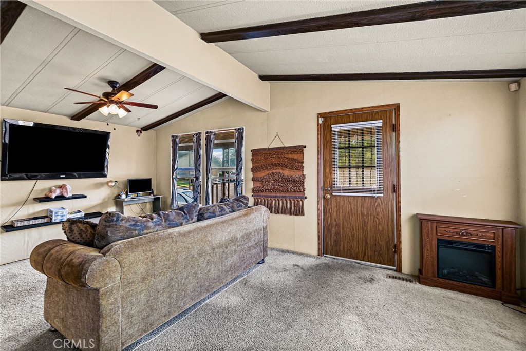 What a value!! Come home to Rancho Chico, one of Chico’s most inviting all-age manufactured housing communities. Known for its sparkling pool and spa, expansive clubhouse, and playground, Rancho Chico blends comfort, convenience, and connection. This well-kept double-wide offers 2 bedrooms and 2 baths, central heat and air, and dual-pane windows for year-round comfort and efficiency. Start your mornings sipping coffee on the covered front porch, and appreciate the convenience of ample parking with a covered carport. Just steps from the recreation center, you’ll love cooling off in the sparkling pool during Chico’s summer heat, unwinding in the spa, or hosting gatherings in the large rec hall. The community’s well-maintained grounds and welcoming atmosphere provide a serene backdrop for everyday living. Plus, you’re minutes from Chico’s beloved Degarmo Park and dog park, offering even more opportunities for outdoor recreation. Whether relaxing at home, entertaining with friends, or enjoying nearby parks, Rancho Chico offers a lifestyle that is both comfortable and connected. Call your favorite Realtor to schedule a showing today!