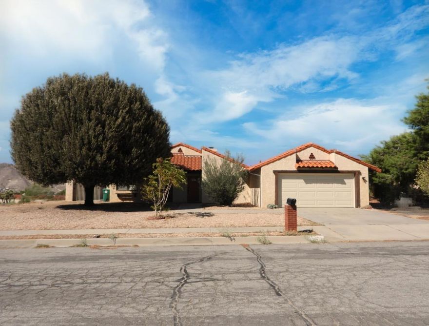 2 bedroom, 2 bath POOL HOME on large corner lot.  Newly updated kitchen.  Large main bedroom.  Second bedroom almost as large as main.   AC and attached 2 car garage with washer/dryer.  Property is set higher than surrounding properties, providing nice views and enclosed by stucco privacy fence.  Pool updated with Pentair pool heater and Pentair remote heater and jet control app.  Side gate for RV parking