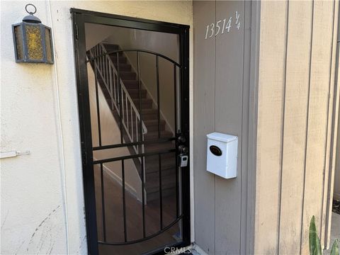 Photo of 13514 1/4 Village DR, Cerritos, CA 90703 (MLS # DW26118287)