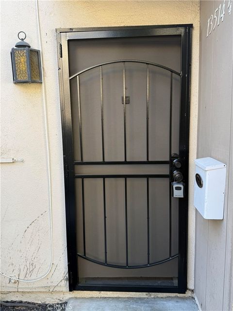 Photo of 13514 1/4 Village DR, Cerritos, CA 90703 (MLS # DW26118287)