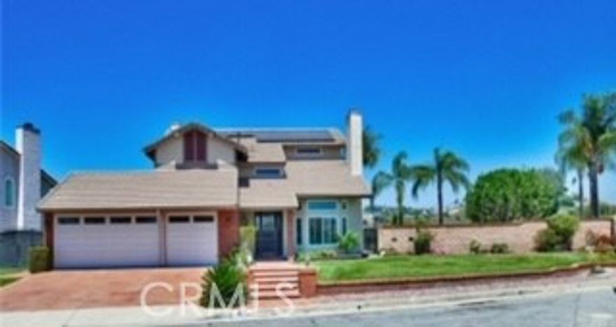 Location, Location, and Location  & Spectacular  Panoramic VIEWS from nearly every room.  This extremely well-maintained home is located at the end of the Cul De Sac, & has one of the largest usable lots in the neighborhood, nearly an acre of land!! (.8 acres as per public records). Did I mention, FULLY PAID SOLAR!!. This home features 5 bedrooms, 3 bathrooms, and 2,755 square feet of living space. Renovated in 2024, The Kitchen has been upgraded with a large island and a wine cooler. Upgraded cabinets throughout the house, & ALL 3 bathrooms have been remodeled as well! Newer dual-pane windows throughout the home. The Main level features a living room, dining room, kitchen with a separate eating area, wet-bar, family room, laundry room, a MAIN FLOOR BEDROOM, and a bathroom with a walk-in shower and direct access to the side/rear yard. The master suite has a private balcony with spectacular views, a large master bathroom with a walk-in closet, a jetted tub, and a separate shower. Three additional bedrooms and a full bathroom complete the 2nd level. The yards are beautifully landscaped, and the rear yard is designed with water conservation in mind! An outdoor BBQ area and fire-pit are surrounded by walkways, trees, and shrubbery. Award-winning Walnut Valley School District***, and Mt. SAC, Cal Poly College are also nearby. Close to parks, 24 Fitness, library, Super markets, and easy access to 57/60/10 freeways. THIS HOME A MUST SEE!