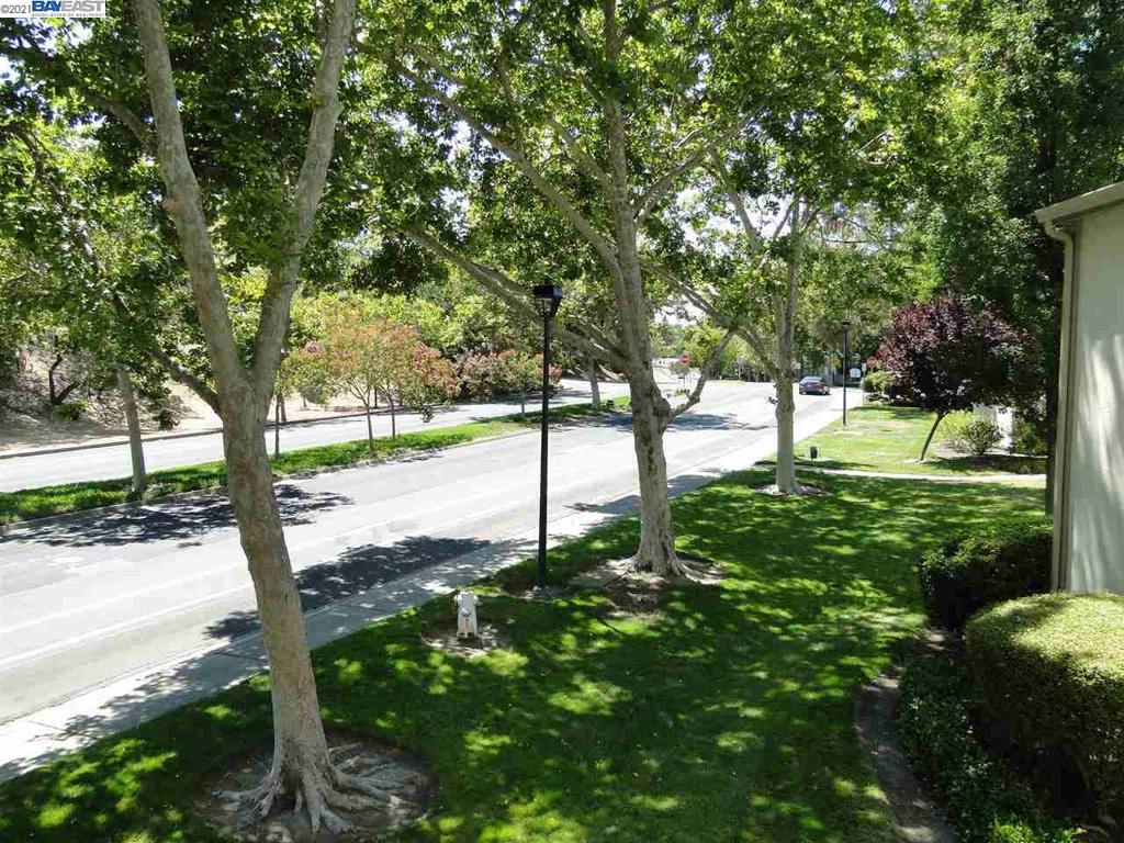 Nestled on a tree lined street in a coveted and desirable Pleasant Hill neighborhood. This home has it ALL!!! Kitchen was just remodeled with granite counters and a breakfast counter. All interior was painted. This unit comes with an assigned carport and an extra storage unit. Lots of natural light and yet no neighbors facing the windows. The view from every window of this home will transport you to a 5 start resort. Recessed lighting and laminate flooring throughout, fireplace in the living room and much more. All this and it is also minutes from shopping & entertaining, freeway access and DVC. All you need is to just MOVE IN.