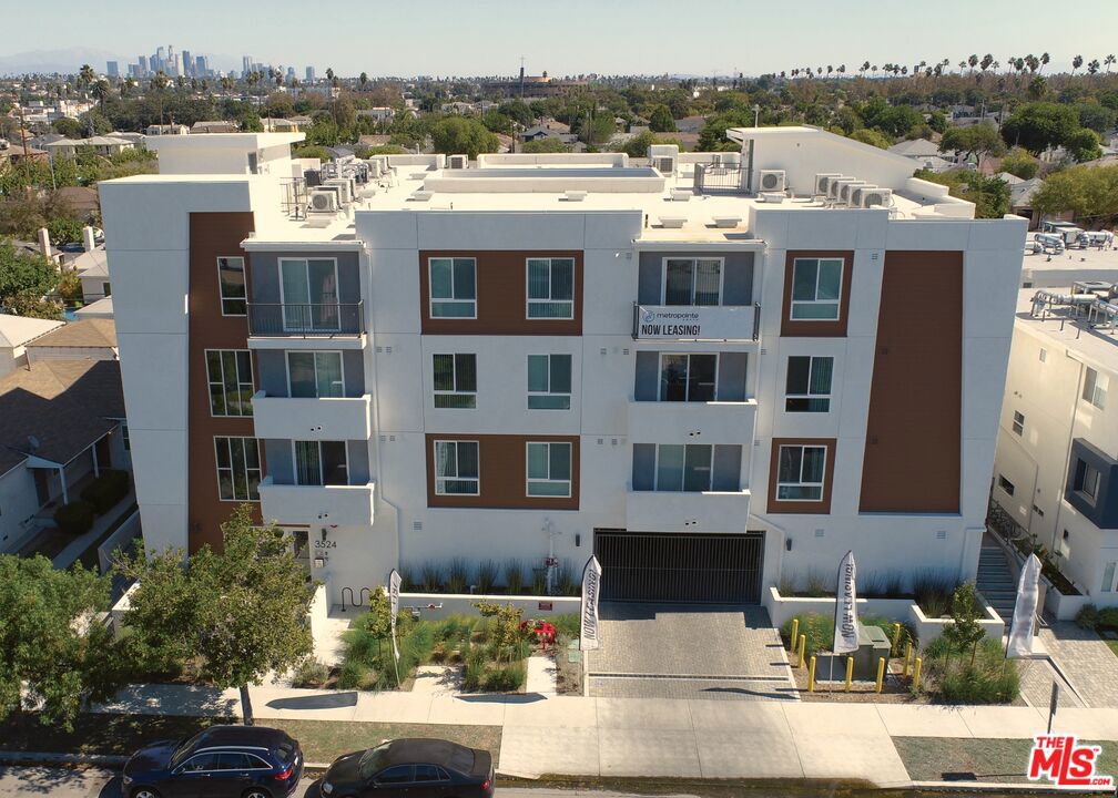 We are proud to present for sale a 2021 New Construction, 27-unit luxury apartment complex located in the West Adams submarket of Los Angeles. The property is ideally situated at 3524 Chesapeake Ave. (a quiet, residential street) and 3 doors down from Exposition Blvd., with the Metro (E) Expo Line Station just one block away. Built with modern systems and expectations, this building has pristine comfortable apartments, an incredible unit mix and views over neighboring properties from many units. The property boasts Eighteen 1 bedroom, 1 bathroom units, and Nine 2 bedroom, 2 bathroom units (3 of which are deemed affordable). Amenities include common area benches and tables, and a gym. The densely populated location with easy access to the 10 freeway and the Metro (E) Expo Line ensures a constant demand to lease up vacancies, allow for tenant comfort and investor stability. The area has undergone a major economic renaissance during the past decade, with development as the driving force. The new apartment and mixed-use developments in the immediate area have provided an overwhelming increase in the demand for high end rental units and retail. This central-courtyard building has a gated garage with 16 side-by-side parking spaces (with separate income), a gym, fire sprinklers, and an inviting entryway that leads to a mail room and elevator. All units have a washer & dryers and balconies, as well as all the modern conveniences of living in a brand-new building. The property comes with Ready-to-Issue Plan Check to convert the recreation room and storage space to two Accessory Dwelling Units, which would bring the total unit count of the building to 29 units.