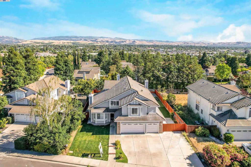 This stunning home sits in a peaceful, and desirable top Livermore neighborhood. This beautiful home boasts a 5-bedroom residence and features a full bedroom and bath on the main level, perfect for guests or extended family. The spacious layout includes vaulted ceilings in the living and dining rooms, an open-concept kitchen and family room, and generously sized bedrooms upstairs and down. Step into a serene and inviting backyard where you feel the private oasis of tranquility, great for entertaining guests or having a nice quiet time with friends and family but yet very practical with a special feature of a huge side yard. https://player.vimeo.com/video/1094799336?h=42dd58babf OH Sat-SUN 1:30-4:30PM