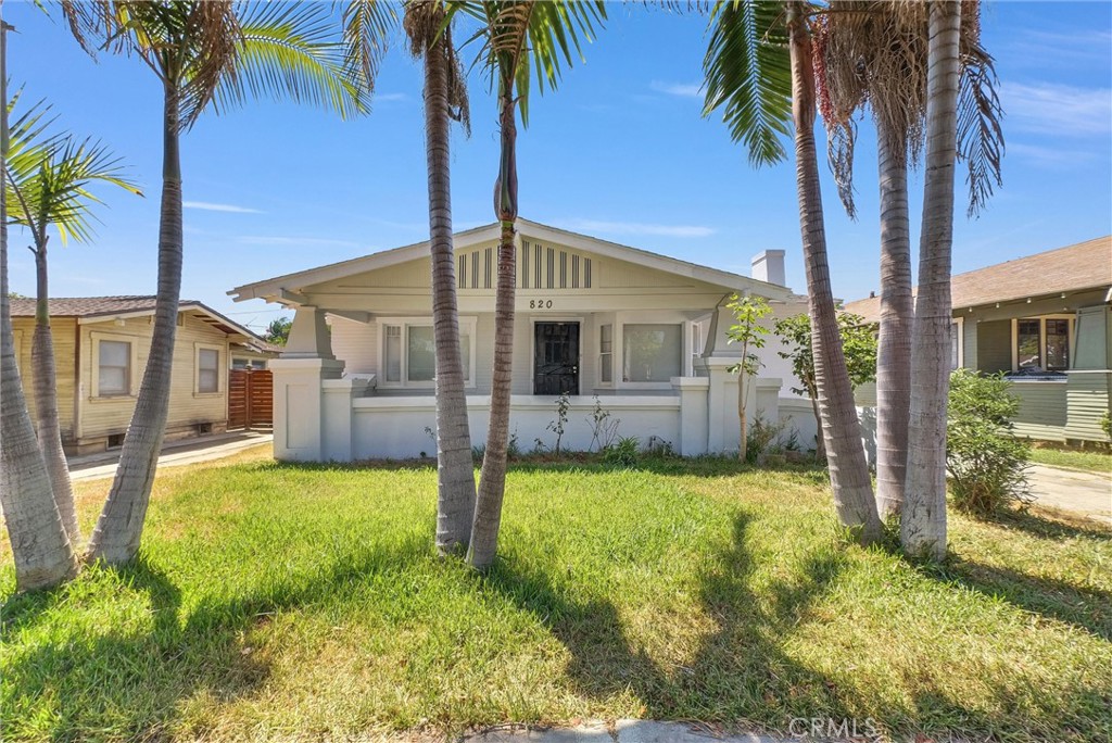 Step into the charm of this delightful 1921 home nestled in the heart of Santa Ana. Offering 4 bedrooms and 3 bathrooms across 1,360 sq. ft. of living space, this home is filled with warmth and character. Situated on a spacious 6,250 sq. ft. lot, you'll enjoy a lovely front yard and a welcoming porch, perfect for relaxing and taking in the evening breeze. The interior features an open-concept kitchen that flows seamlessly into the cozy living room with a fireplace, ideal for gatherings or quiet nights in. A long driveway provides ample parking for 3+ vehicles and leads to a detached 2-car garage. The generous backyard patio offers the perfect space for entertaining friends and family or enjoying a quiet moment outdoors. Don't miss this opportunity to own a piece of history, come see this charming home and make it your very own home sweet home!