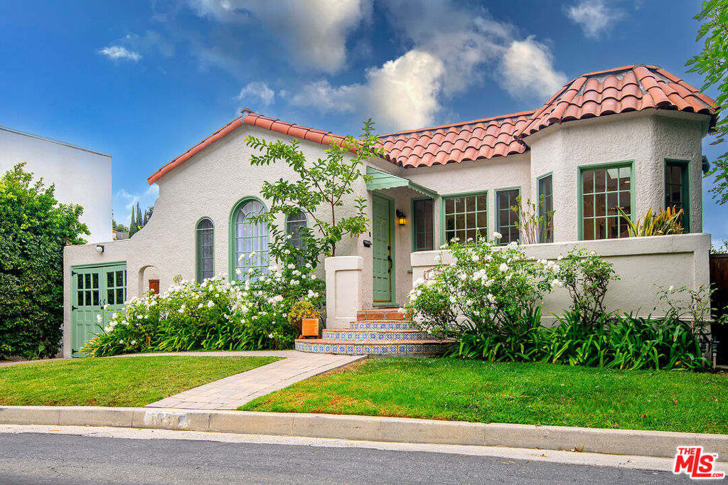 Tucked away in an exceptionally quiet hillside pocket north of Sunset Junction in Silver Lake, this 1930s character 3BR/3BA Spanish offers timeless charm paired with today's modern conveniences. With serene hillside views, the home welcomes you with a formal living room anchored by a decorative fireplace, a cozy den, and a recently renovated kitchen featuring a dining bar, upscale stainless-steel appliances, built-in wine refrigerator, and pantry. The primary suite includes a Juliet balcony, renovated bath, and generous walk-in closet, while a secondary bedroom and hallway bath complete the main level. The lower level offers a spacious permitted guest suite with its own renovated bath and walk-in closet, perfect as a private office, creative studio, or extended-stay retreat, thoughtfully separate from the main living areas .Entertain with ease on the expansive deck overlooking a private landscaped yard filled with lemon, orange, avocado, and Asian pear trees. All this, just moments from the Silver Lake Reservoir, dog park, and the vibrant heart of Sunset Junction with its endless mix of shops, restaurants, and cafes.