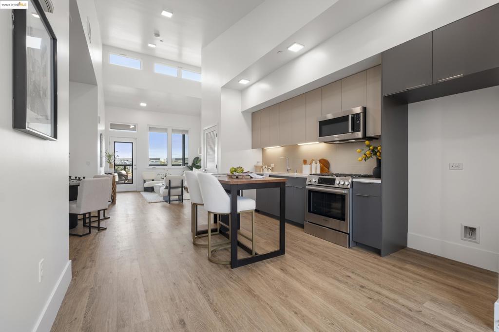 TOP FLOOR Stunning two bedroom and two bathroom Brand-New Construction in Dogtown! CURRENTLY OFFERING 3% towards closing costs! Welcome to the vibrant Dogtown Arts District in Oakland, where 47 brand-new condominium homes await! These thoughtfully designed residences boast soaring ceilings, abundant natural light, and striking interior finishes throughout. Step inside to a bright, open floor plan featuring premium upgrades and modern design touches. The spacious bedrooms include generous closets, and the unit is equipped with in-unit washer and dryer hookups, air conditioning, and private outdoor space. Enjoy the convenience of secure garage parking and unbeatable access to shopping, Highway 24, 580, and the Bay Bridge—ideally located at the Oakland/Emeryville border. Pictures of the unit may not be the pictures of this unit. SUN 1-4PM
