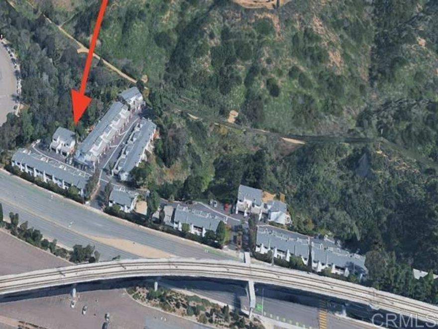 Stunning La Jolla Vista Townhome. Prime Location! Incredible location across from Scripps Memorial Hospital, just a short walk to UCSD, Westfield UTC Mall, the new trolley line, hiking trails, coffee shops, and restaurants. This beautiful 4-bedroom, 3-bath townhome offers 1,676 sq. ft. of comfortable living space in a peaceful natural canyon-rim setting with scenic views. The home features an attached 2-car garage plus one assigned parking space, and is part of a PUD community with a private backyard patio area perfect for relaxing or entertaining. Enjoy a spacious open floor plan with a large living and dining area, and a primary bedroom with walk-in closet and private balcony. The kitchen provides ample cabinetry and counter space, complemented by laundry hookups in the garage and generous storage throughout. Community amenities include a pool and clubhouse, and the HOA covers water and basic cable. Conveniently located in a high-rental-demand area, this home is move-in ready .