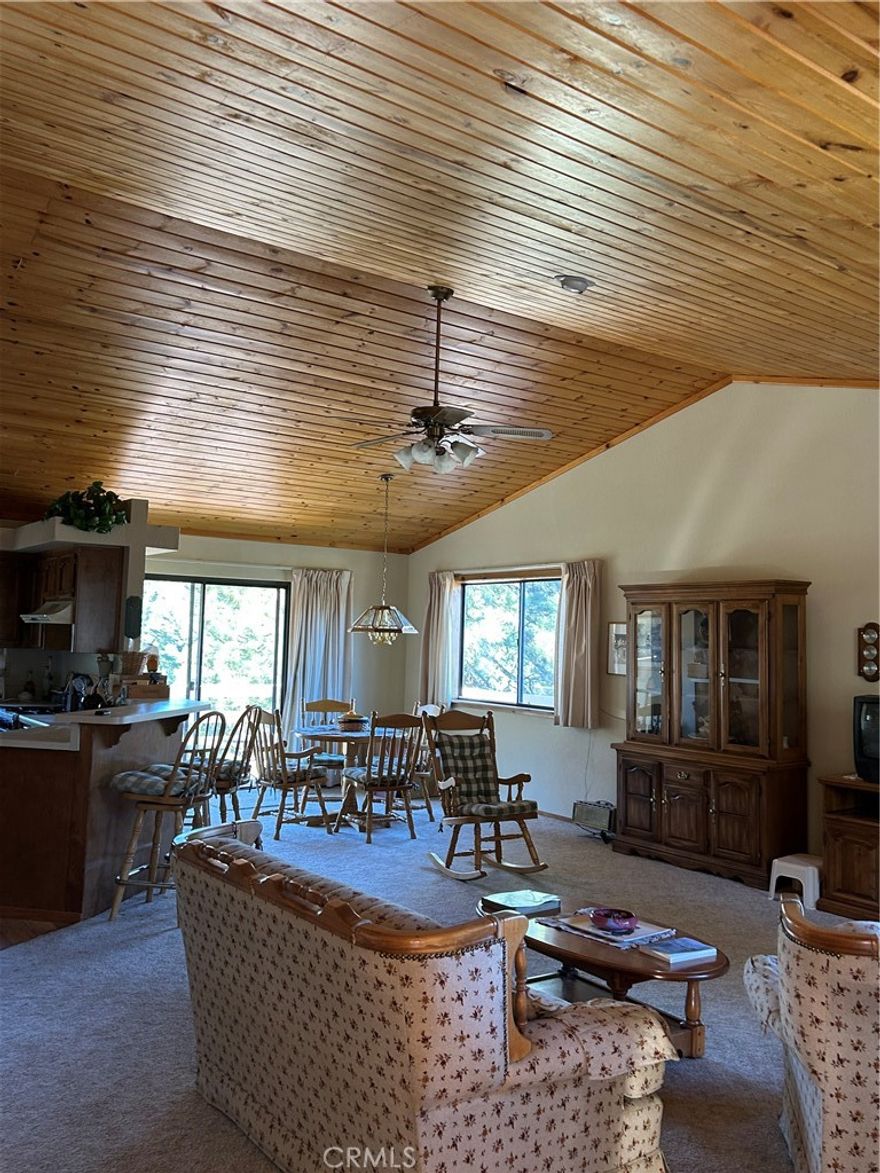 2017 Zermatt Drive is a cozy retreat nestled in this rich paradise. This inviting home features two bedrooms—including a spacious primary suite with a walk-in closet and private bath—vaulted ceilings, large windows for abundant natural light, and an open kitchen and dining area leading to a private deck with beautiful views. Stay comfortable year-round with a cozy wood stove, forced air heating. Additional perks include an indoor laundry area, one-car garage with extra storage, and a convenient half-circle driveway with extra parking.   Experience the joy of mountain living in a community where there’s always something to do! From swimming, tennis, and golf to horseback riding, fishing, and scenic hiking trails, Pine Mountain Club offers endless activities for all ages. Enjoy lively community events, friendly neighbors, and a welcoming atmosphere that makes every day feel like a getaway. Community amenities include an pool and spa, tennis and pickleball courts, a nine-hole golf course, fishing pond, horse stables, private campground, dog park, playground, restaurants, shops, 24/7 patrol, and more. With maintained roads and emergency services nearby, you’ll have peace of mind and plenty of ways to enjoy life. Whether you’re seeking a weekend escape, a full-time residence, or an investment, this home is your gateway to fun, relaxation, and a truly great community. Don’t miss your chance—contact us today to schedule a tour