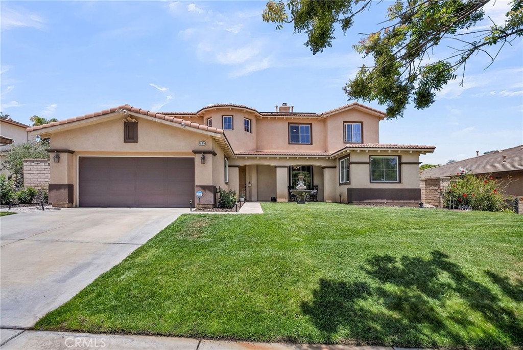 Located in the highly sought after community of Eagle Glen in Corona this luxurious property boasts of natural light, open floorplan, vaulted ceiling, custom backyard design and so much more! The vaulted ceilings in the front living room welcome you into the home and set the tone for the overall experience. The kitchen includes plenty of cabinetry, granite counter tops, and an oversized center island that opens directly into the secondary family room. The first floor also includes a formal dining room, secondary dining room, guest bedroom and bathroom as well as a laundry room. The grand staircase in the center of the home is wide and leads to the second level that offers a bonus room, two guest bedrooms and bathroom, and of course the primary suite. The primary bedroom is large and overlooks the backyard. The primary suite includes walk-in shower, dual sinks, soaking tub, and walk-in closet. Adjacent to the primary suite you will find an additional private office that is only accessible from the primary bedroom. The backyard has been updated recently to include an end-to-end patio cover, BBQ area, and custom fireplace along with seating area. The artificial turf and drought resistant landscaping is an added benefit and helps complete the overall presentation of the backyard. Located blocks from Wilson Elementary School, toll road access, and close to shopping/dining, this Corona home has everything you need!