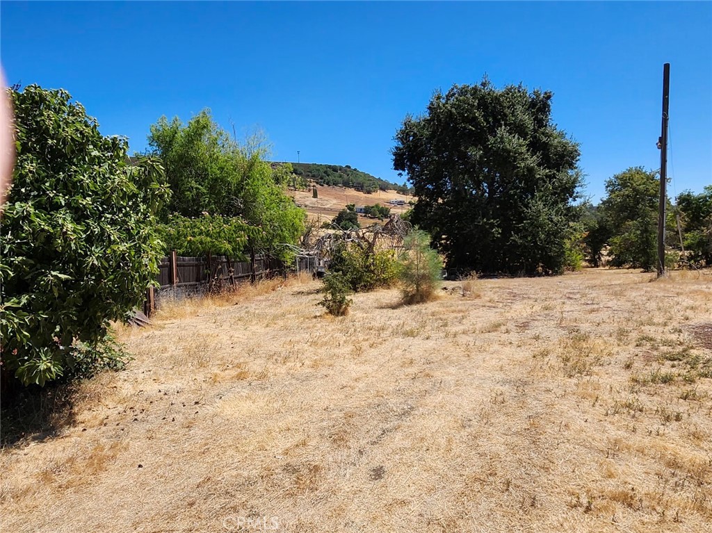 Amazing Place to Build Your Home. Sewer is Already Connected. There was once a mobile home on the property. Check with City of Clearlake about Reduced Cost of Permits because of Former Residence. Property gently slopes from the street. There are some fruit trees including a few Fiig Trees and a Large Oak. Propety is fenced with a gate at entry. There is a power pole on the property.
The Neighboring Residence is Available Separately. Ask Agent for Details.