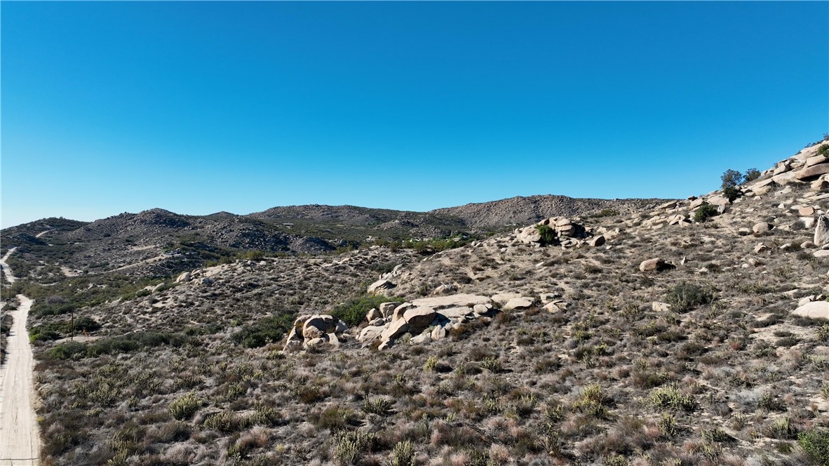 Beautiful 10.95 acre parcel of land in Aguanga Ranchos neighborhood of Aguanga. This lot has gorgeous rock features combined with usable land in and around rocks and the lot slopes upward from the access road. Great views! Zoning is R-!-10- Residential Agriculture Zoning.  Located at 2800 Ft elevation it is a great area to grow your own food. You will need to drill a water well. 30 minute drive to City of Temecula. Adjacent lots also for sale by same owner. ** Ask your agent or listing agent for zoning write up **