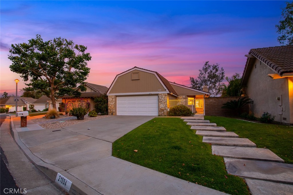 Location, location, location! Located in the “Rancho Dominguez Homes” development this beautiful single story has been well-maintained over the years. Located on a single loaded street with direct access to Dominguez Trailside Park, this home has much to offer! With 3 bedrooms and 2 full baths, this home offers 1,565 SF with an attached 2-car garage and extra-long driveway, great for parking multiple cars. With serene landscaping, the courtyard entry offers lots of privacy with tropical palms, roses, and lush shrubs, perfect for outdoor dining. Many features include gorgeous custom wood + glass front door, wood plank flooring, neutral two-tone interior paint, recessed lighting throughout, dual paned windows, as well as plantation shutters. Kitchen is HUGE! With real wood cabinetry, granite countertops, and granite backsplash, as well as a charming dining nook area. There is a separate dining room that looks over a light and bright courtyard with vinyl lattice patio cover for shade. All rooms are generously sized, while Master Bedroom has mirrored wardrobe closets, as well as direct access to your serene back patio with clear views of Anaheim Hills and City Lights! Master Bathroom has a full tub, full shower and dual sink vanity. The living room entry offers pitched ceilings with granite surround fireplace. BRAND NEW FURNACE AND AC. NEWER DUAL PANED WINDOWS AND SLIDERS. This floorplan is suitable for any type of family offering a great entertaining space both inside and out. The lovely backyard offers a picturesque view AND direct access to Dominguez Trailside Park feeling like it’s your own private park! Just a short two minute drive to Travis Ranch School as well as surrounding shops, horse trails, parks and restaurants, you will love this location in Yorba Linda!