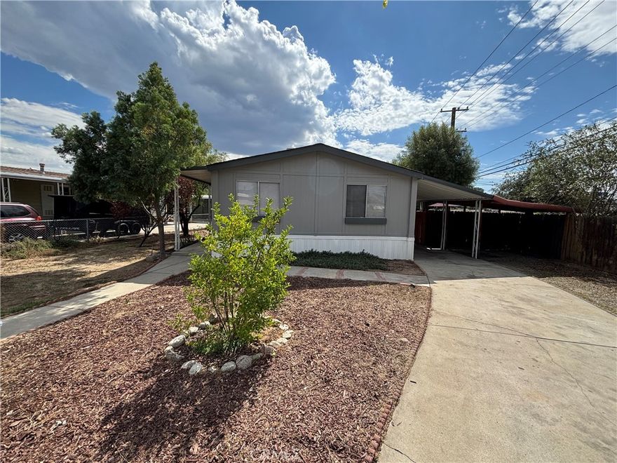 SPACIOUS WELL APPOINTED MFG. HOME WITH DUAL STREET ACCESS! - Lovely 3 Bedroom, 2 Bath home, recently remodeled, with new paint, appliances, and flooring. Quaint, raised patio deck for outdoor living. Additional 9'x 18' building with power. Perfect for possible ADU, workshop or storage.  Plenty of room for parking or storage. This property perfect for shade-tree mechanic, Contractor, large family, or hobbyist.