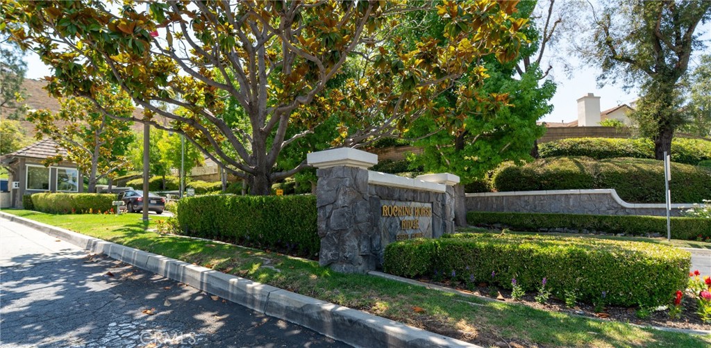 Discover this beautifully maintained 3-bedroom, 2.5-bath townhome in the desirable 24-hour guard-gated Rocking Horse Ridge community, nestled in the scenic hills of Orange. Natural light pours into the open, airy floor plan featuring soaring ceilings and a cozy fireplace in the living room, creating a warm and welcoming space. The updated kitchen opens to the family and dining areas and showcases quartz countertops, modern backsplash, recessed lighting, remodeled cabinetry, and a newer sink and faucet. An added bank of cabinets offers valuable extra storage and prep space for everyday living and entertaining. Downstairs features elegant wood and tile flooring throughout. Upstairs, you’ll find two spacious primary suites, each with its own private bath and ceiling fans. The main primary suite includes a walk-in closet and a ceiling fan for year-round comfort.
Step outside through dual sliding glass doors to your private, low-maintenance backyard patio with a brick surface and vinyl fencing—perfect for relaxing or entertaining. Additional features include a large attached two-car garage with direct access, a roll-up door with automatic opener, a newer water heater, and ample storage space. Residents enjoy resort-style amenities, including a community pool and spa, in a beautifully landscaped, secure community close to everything Orange has to offer.