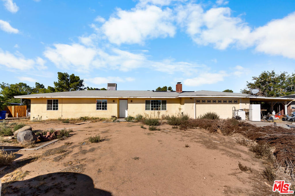 **STANDARD SALE  BEING CONDUCTED AS AN AUCTION. DISCLOSURE PACKAGE AVAILABLE UPON REQUEST AND UNDER DOCS. NO SHOWINGS UNTIL SATURDAY AND SUNDAY.** This 3-bedroom, 2-bath home offers approximately 1,551 sq. ft. of living space on a spacious 1-acre lot, providing privacy and open desert surroundings. Located in a quiet and rural area of Apple Valley, this property is ideal for buyers looking for space, seclusion, and potential. The home features a functional floor plan, a large living area, and an additional bonus room/office off the kitchen, and a septic tank that was replaced in 2013. The property is in mostly original condition and offers a great opportunity for updates, customization, or investment. Outside, the expansive lot provides ample room for RV parking, equipment, storage, or future improvements (buyer to verify). **A two-day auction-style sale will be conducted on October 25th, and October 26th from 1:00 PM to 3:00 PM. No registration is required, and all interested buyers are welcome to attend.**