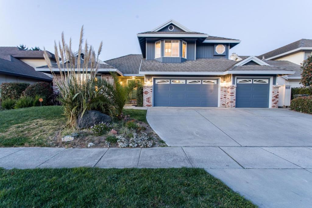 Welcome to your dream home! This beautifully maintained 4-bedroom, 3-bathroom residence offers the perfect blend of elegance and functionality. With spacious, light-filled living areas and an open-concept layout, its ideal for both everyday living and entertaining guests. Spacious kitchen features modern appliances and ample cabinet space that opens into the family room with a cozy fireplace. A separate dining area adds charm and flexibility. The luxurious primary suite includes a walk-in closet and spa-inspired en-suite bathroom with dual vanities, soaking tub, and separate shower. Three additional bedrooms offer generous space for family, guests, or a home office. Outside, enjoy a private backyard perfect for summer barbecues or relaxing evenings.