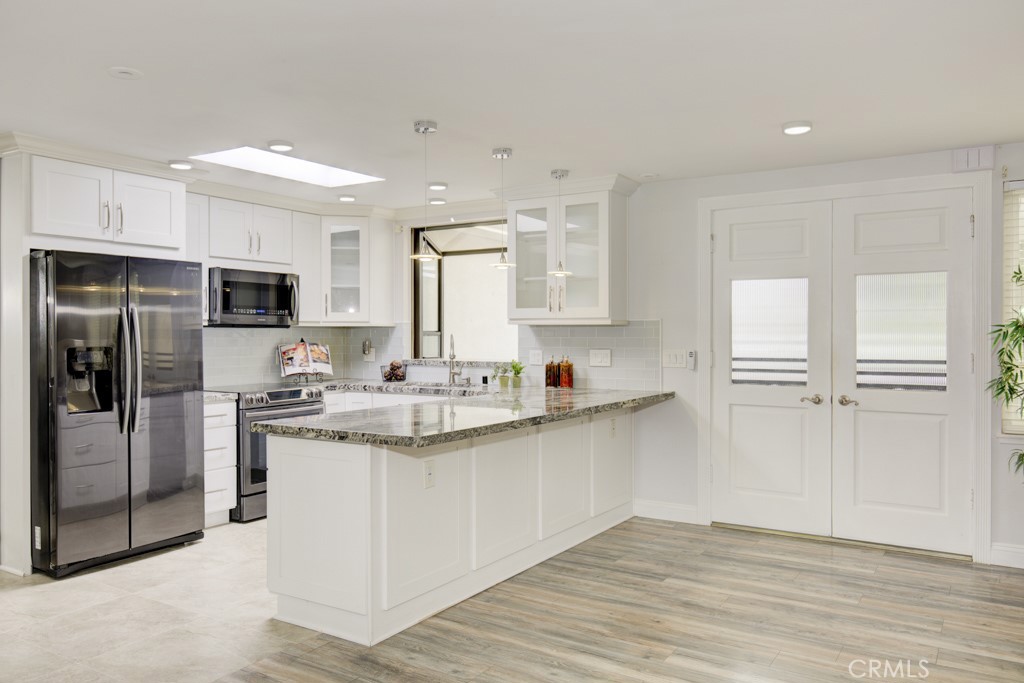 Exquisitely Upgraded Home with Enclosed Atrium and Spacious Patio!
Welcome to this tastefully upgraded home where style meets functionality - COVETED CORDOBA MODEL - The beautifully remodeled kitchen features Samsung stainless appliances, including a glass-top range, oven, and microwave, rich slab granite countertops, custom cabinetry with two carousels and a garden window overlooking the covered patio.
The enclosed atrium adds valuable living space with articulating skylights for abundant natural light. It opens seamlessly to the spacious living room and connects to the primary bedroom through a pocket door. The dining room boasts a skylight and mirrored doors revealing a large storage closet.
The guest bathroom offers a high vanity with slab granite, an undermount sink, and a step-in shower with bench and shower wand. A convenient washer/dryer is nearby for easy access. The guest bedroom features a sliding door to the carport, ceiling fan, blinds for privacy, and a triple floor-to-ceiling closet for extra storage.
The home’s double wrought-iron gate opens to a spacious covered patio with daylight panels, ceiling fan, and double screen doors. This inviting space is perfect for outdoor dining or lounging and includes a handy storage closet for garden tools, luggage, and more.
Lush greenery and thoughtful upgrades make this home move-in ready and truly special.
Ownership affords you the use of all the amenities that make Laguna Woods Village one of the most sought-after senior communities. Enjoy 5 swimming pools, 7 clubhouses, 3 gyms, craft studios, 2 gorgeous golf courses (27 hole & 9-hole par 3), over 250 social clubs, performing arts theater, tennis courts, equestrian trails, stable, fare free bus service, golf cart paths, manned security gates, lawn bowling, bocce ball, pickle ball & much more.
